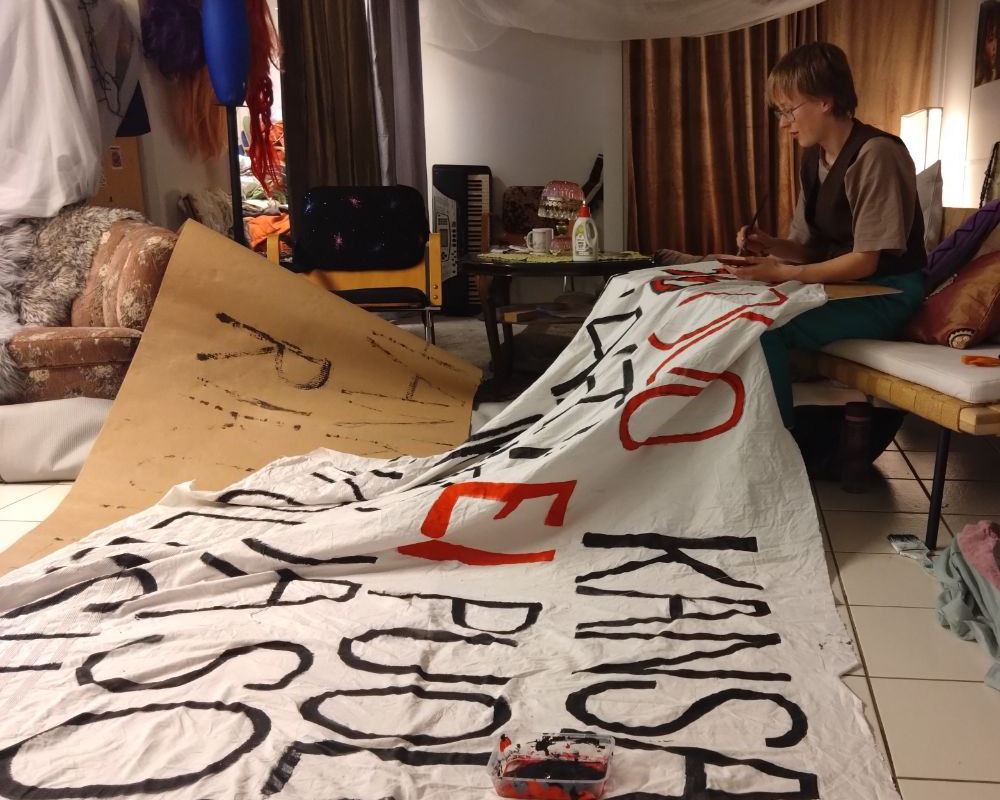 painting a sign for protest